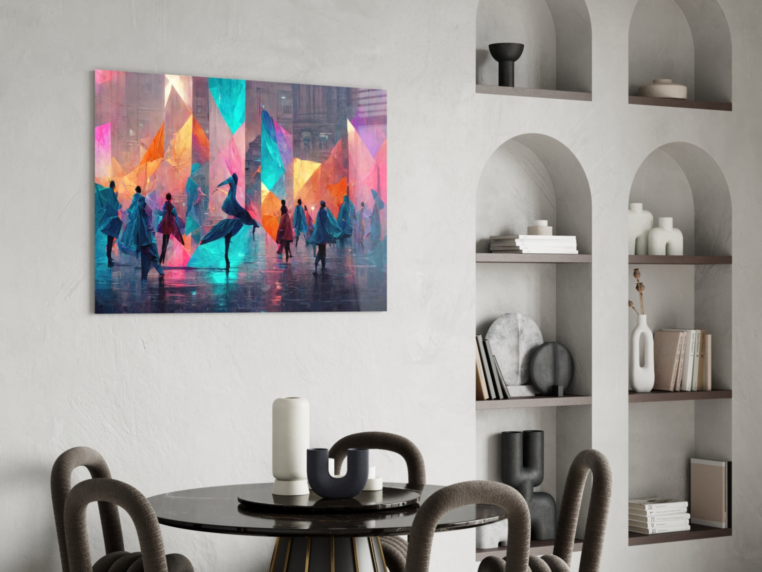 Colorful glass wall art depicting silhouetted figures with vibrant geometric shapes displayed above a round dining table in modern interior setting.