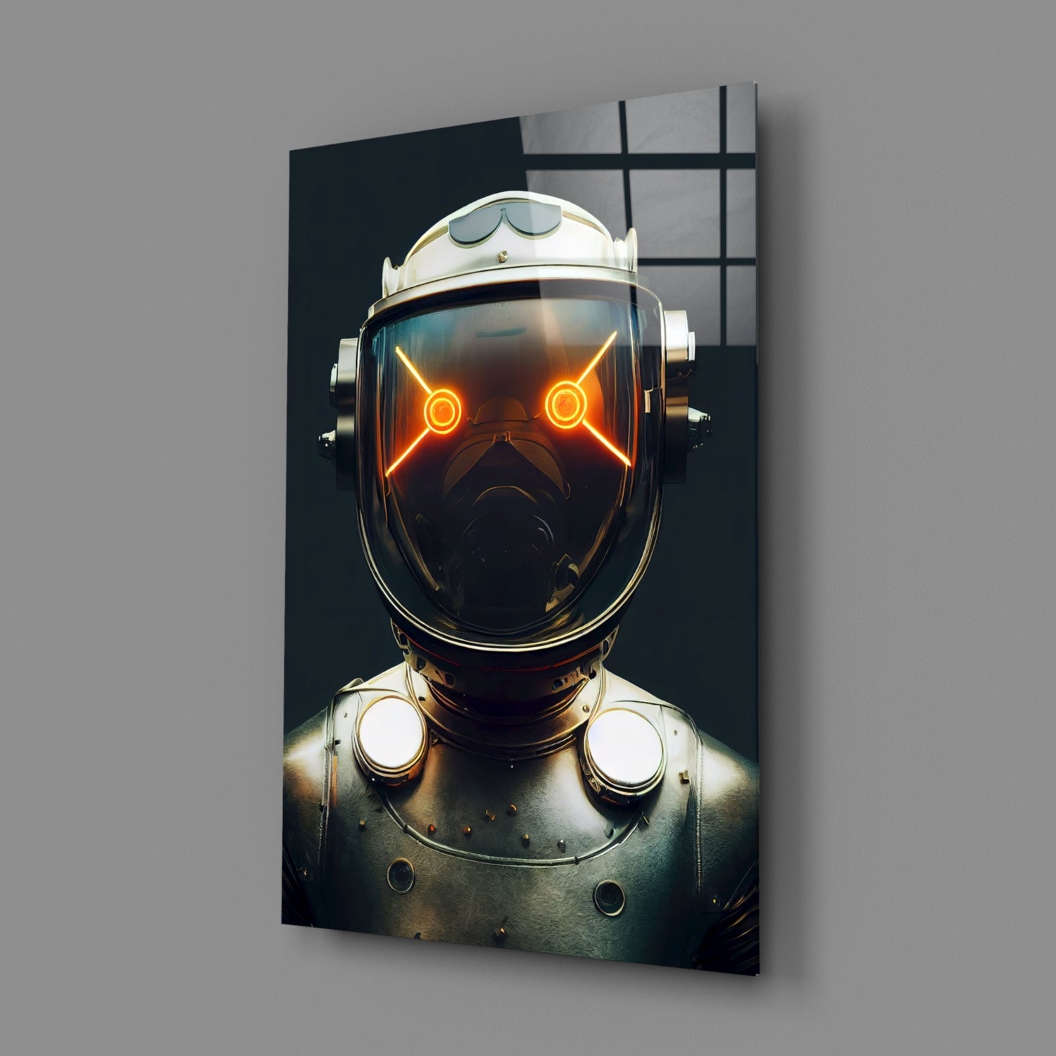 Framed glass wall art displaying a robotic head with glowing orange eyes against a dark background, mounted on a gray wall.