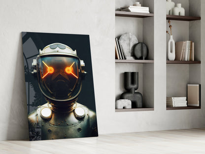 Glass wall art leaning against white wall displays futuristic robot head with glowing orange eyes and metallic details against dark background.