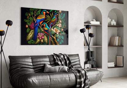 Colorful glass wall art featuring three parrots among flowers and foliage displayed above a black leather sofa in a modern living room.