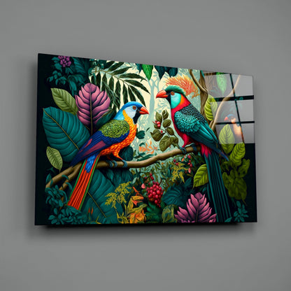 Two colorful parrots perched on a branch surrounded by tropical foliage and flowers on a segmented glass wall art panel.