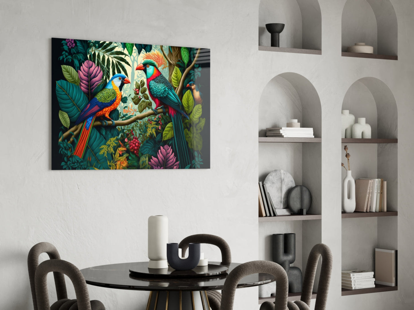 Colorful glass wall art featuring two parrots among tropical flowers and foliage, displayed above a round dining table in a modern interior.