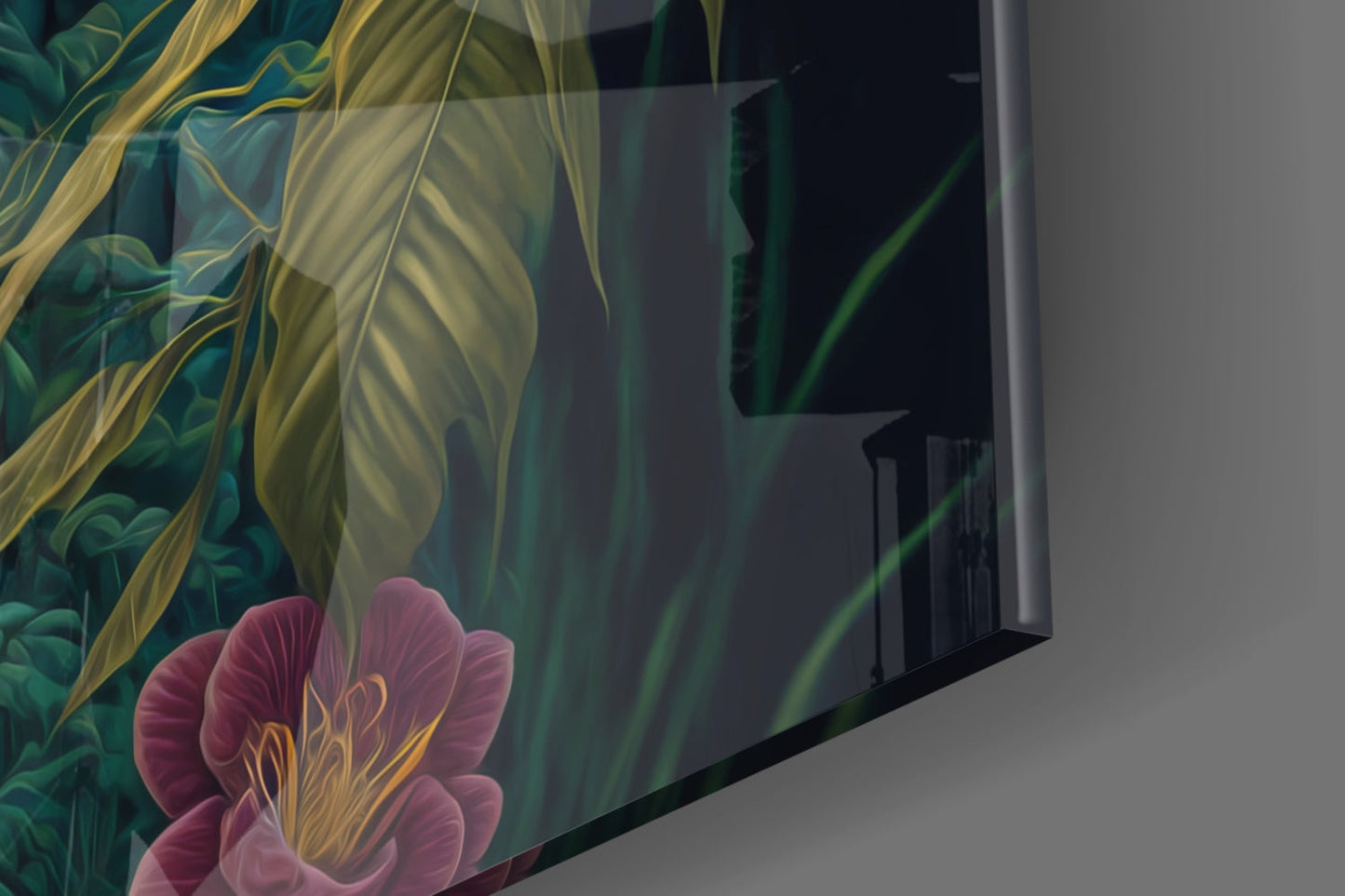 Angled view of glass wall art showing pink and yellow flowers with green foliage against dark background, mounted on gray wall.