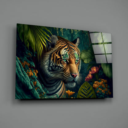 Glass wall art panel displaying a tiger with striking green eyes surrounded by tropical foliage and flowers in rich jewel tones.