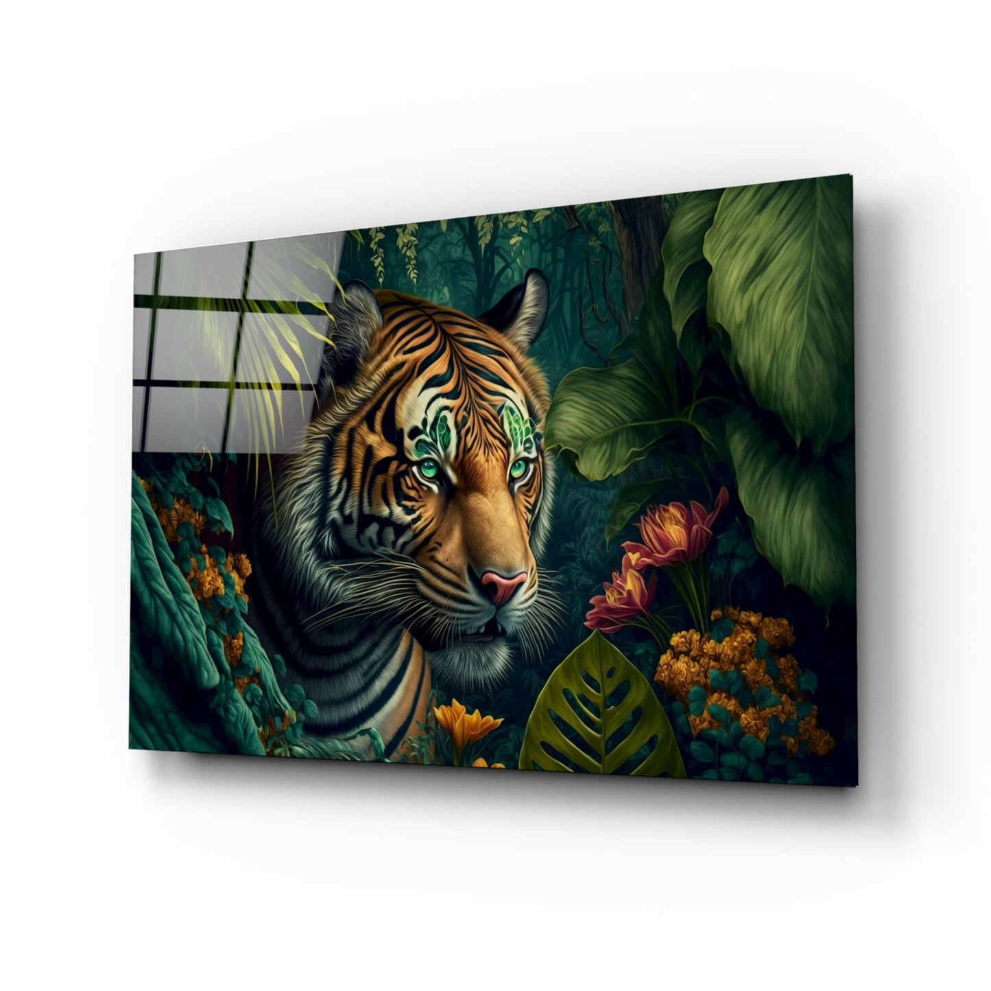 A tiger with striking green eyes peers through lush tropical foliage and flowers on a glass wall art panel displayed at an angle.