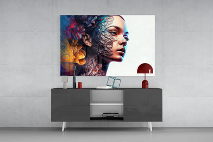 Colorful portrait glass wall art displayed above gray media console with red desk lamp and decorative objects in modern interior setting.