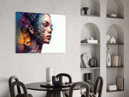Colorful glass wall art depicting a woman's profile with vibrant blue, red, and gold textured overlay, displayed above a black dining table in a modern interior setting.
