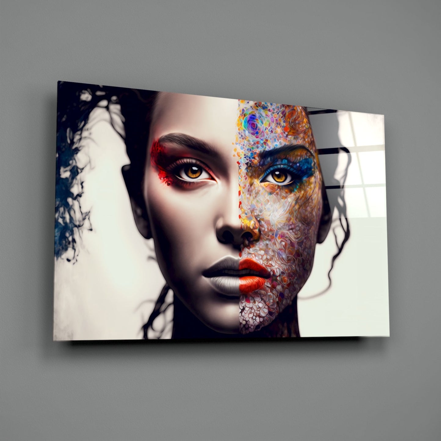 Glass wall art featuring a stylized face with colorful floral patterns on one half and monochromatic elements, displaying vibrant eyes and red lips.
