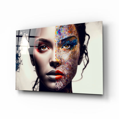 Glass wall art displaying a stylized female face with colorful abstract patterns on half, realistic features on half, mounted at an angle.