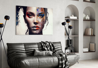 Modern living room interior featuring an abstract portrait glass wall art above a gray leather sofa, displaying colorful artistic face design with vibrant blue, red, and orange elements.