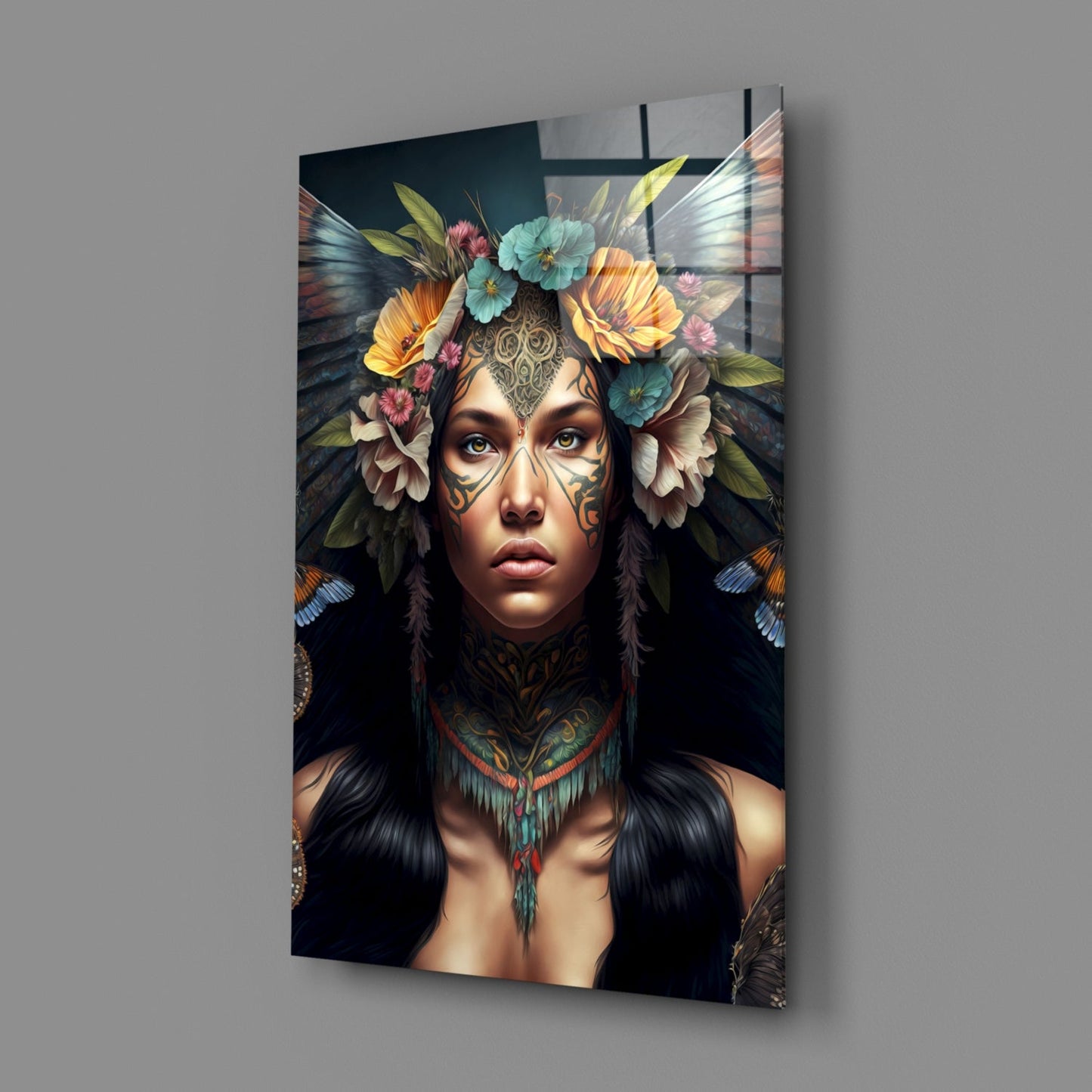 Glass wall art displaying a tattooed figure with facial markings, colorful flowers, and butterfly wings against a dark background.