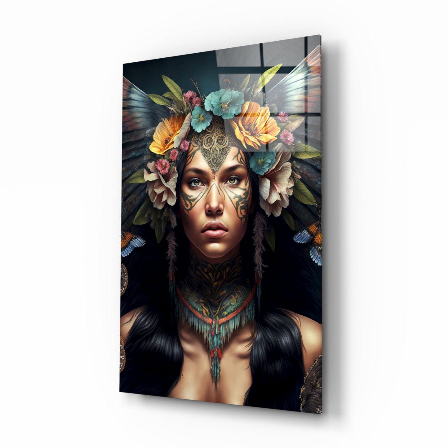 Glass wall art depicting a woman with facial tattoos, flower crown, and butterfly wings against a dark background, displayed at an angle.