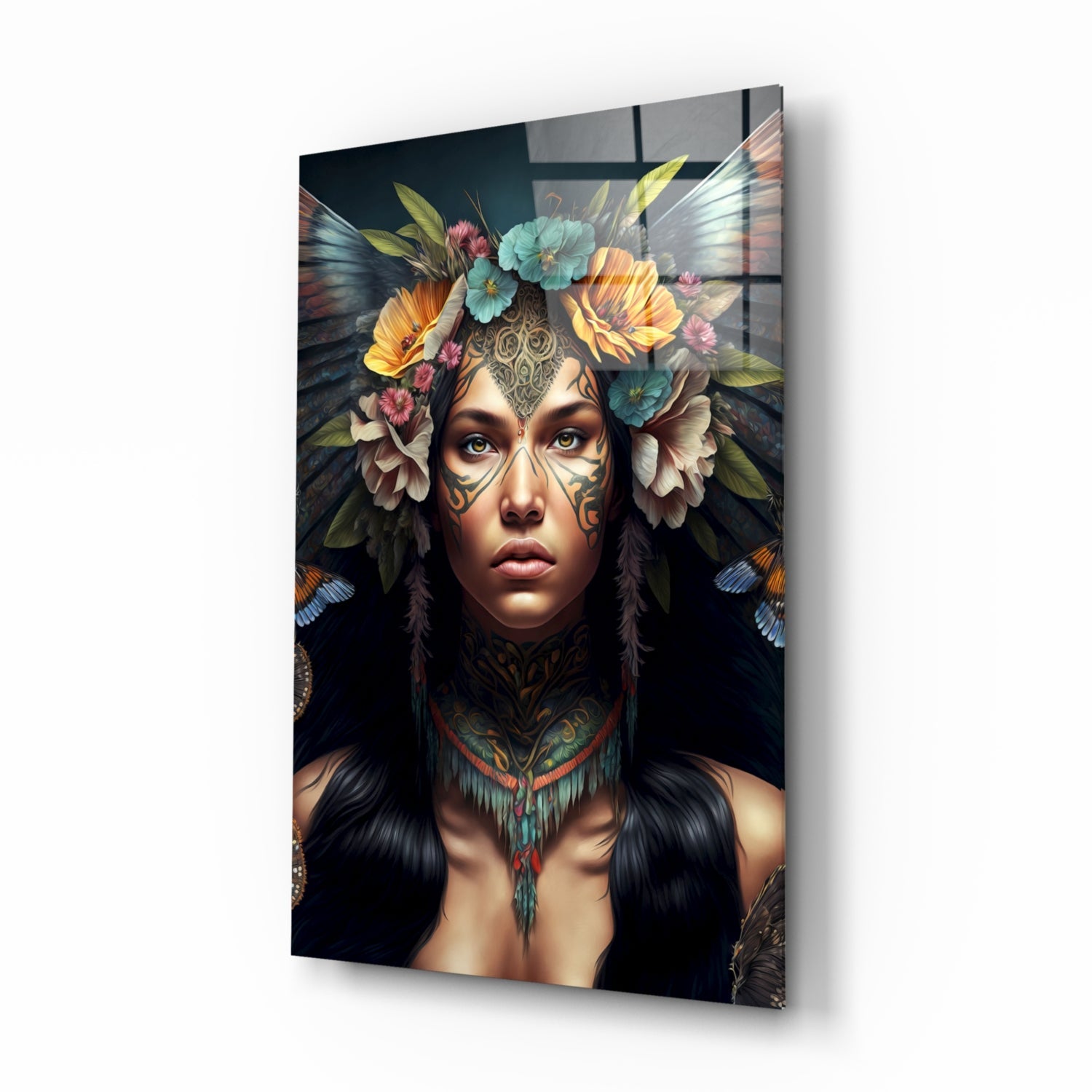 Glass wall art depicting a woman with facial tattoos, flower crown, and butterfly wings against a dark background, displayed at an angle.