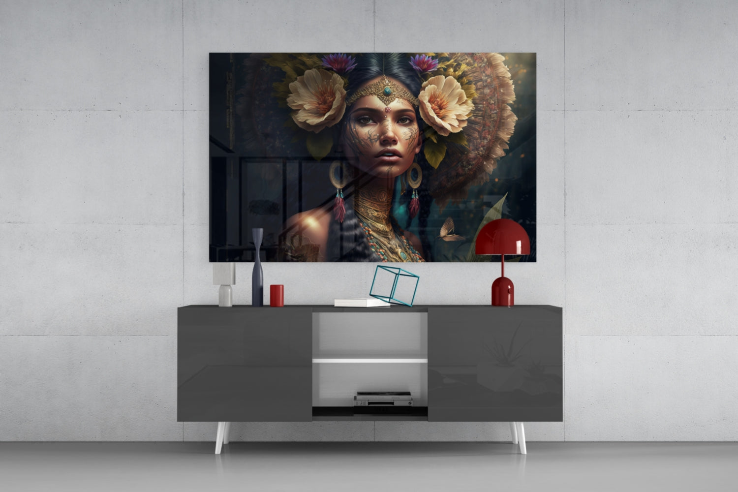 Glass wall art depicting an ornately decorated woman with flowers and jewelry displayed above a modern gray media console in a living room setting.