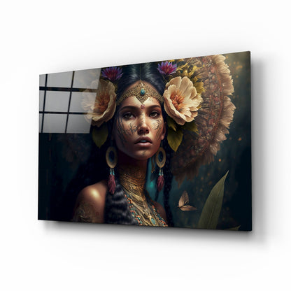 Glass wall art panel displaying a woman with facial tattoos, ornate jewelry, and large flowers in her hair against a dark botanical background.