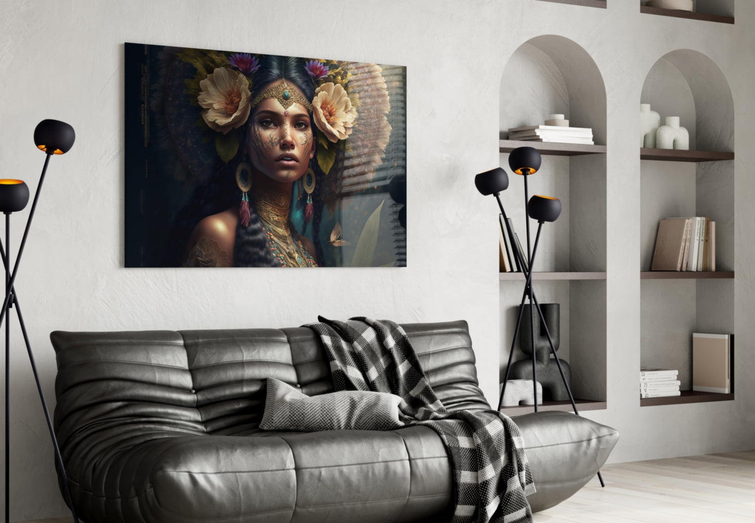 Glass wall art depicting ornate woman with flower headdress and gold jewelry displayed above gray sofa in modern interior.