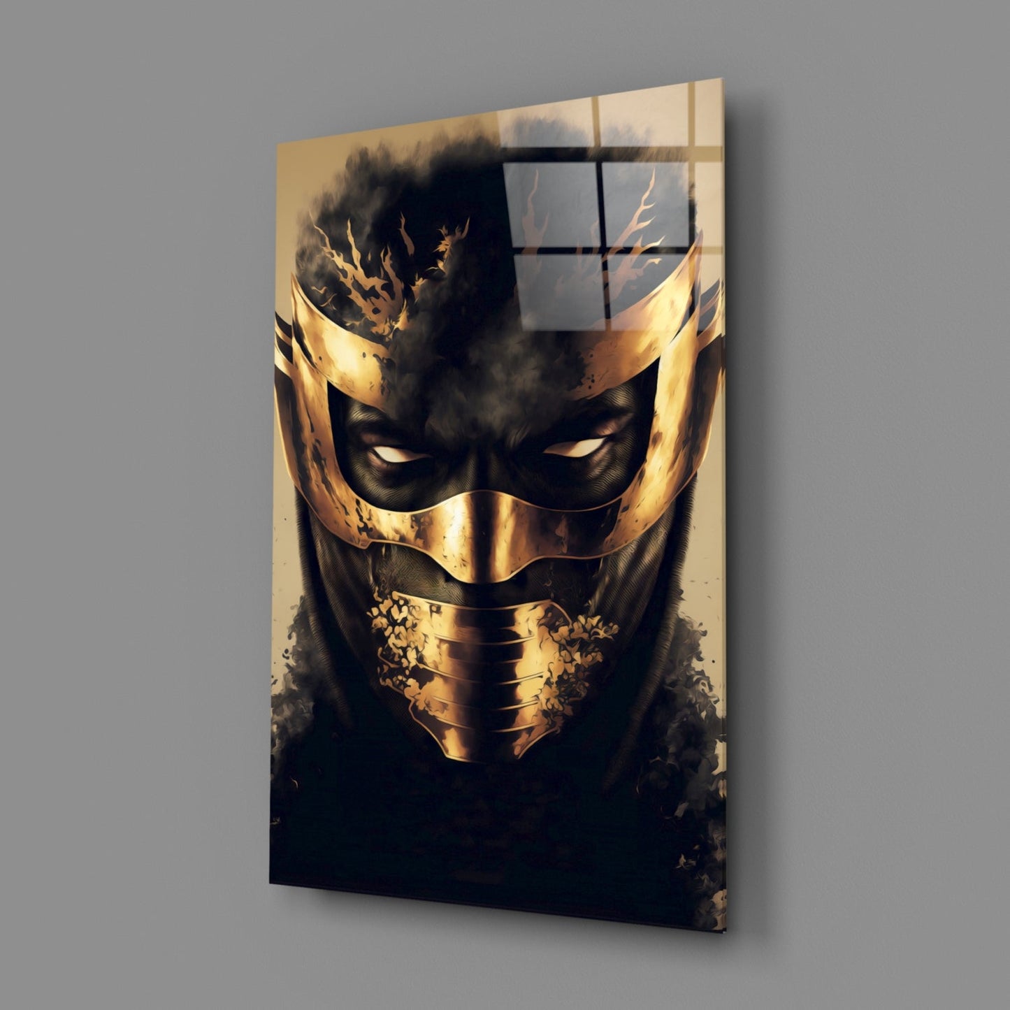 Gold and black masked face with fire effects displayed on angled glass wall art panel against gray background.