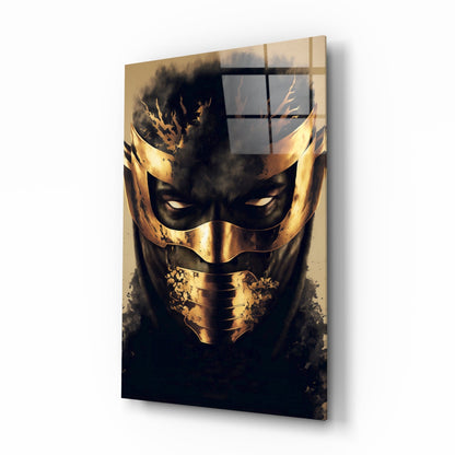 Angled perspective of glass wall art featuring a golden mask with black features and smoky effects against dark background.