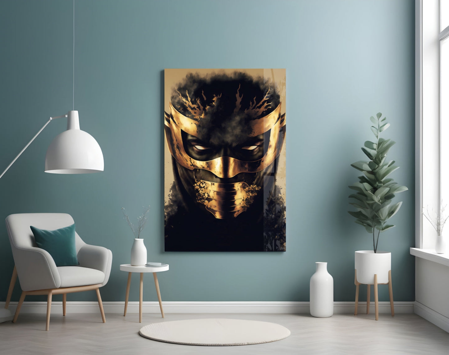 Gold and black masked face glass art displayed on teal wall above white chair and potted plant.