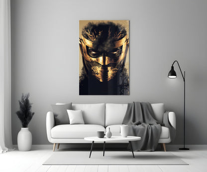 Masked Horror Glass Wall Art displaying a gold and black masked face hanging above a white sofa in a modern living room.