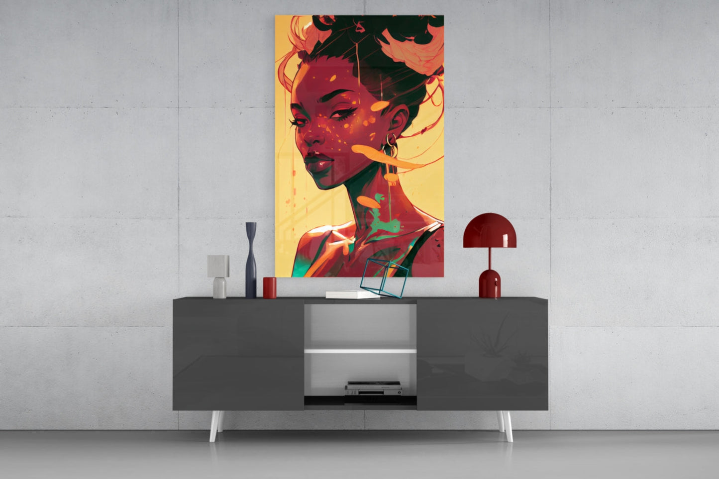 Colorful pop art portrait with warm yellow background and red, orange, and green tones displayed above a modern gray sideboard with white legs and red decorative lamp.