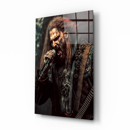 Angled view of a glass wall art panel featuring a long-haired male performer with a microphone, wearing ornate dark clothing against a dark background.