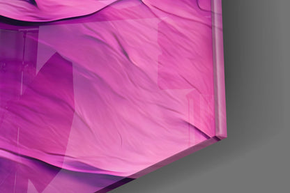 Close-up detail of purple and magenta translucent glass wall art with layered curved surfaces and flowing wave patterns against gray background.
