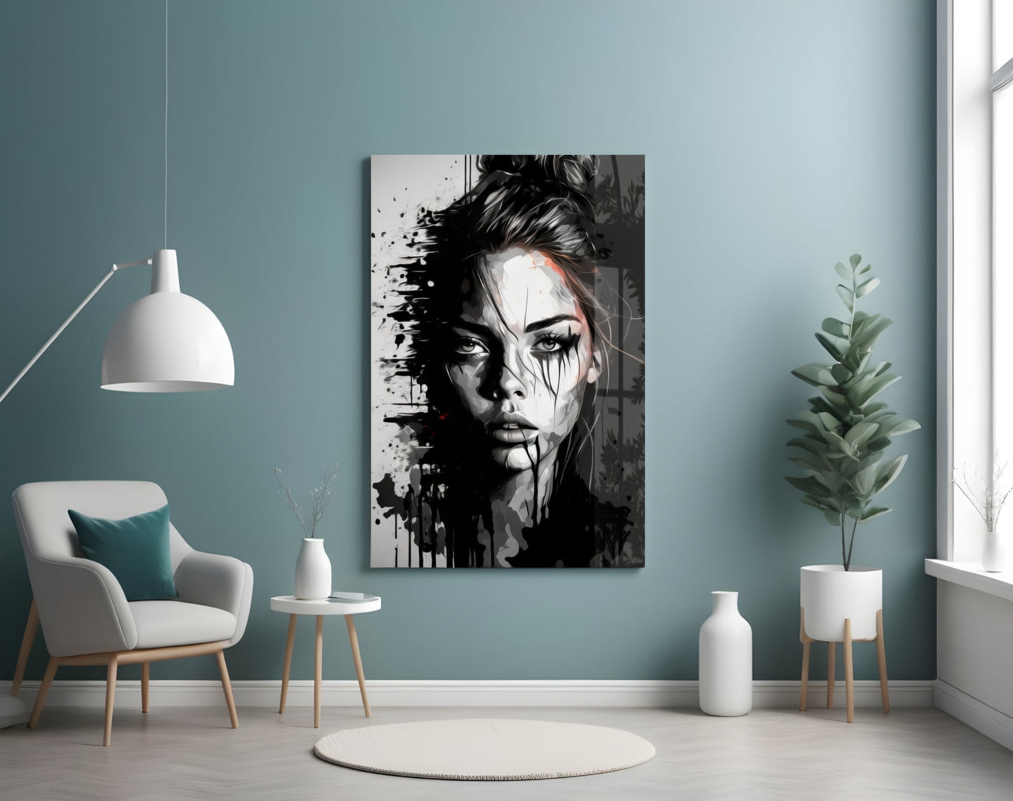 Black and white portrait glass wall art with ink splatter effects displayed above a white chair in a teal room.