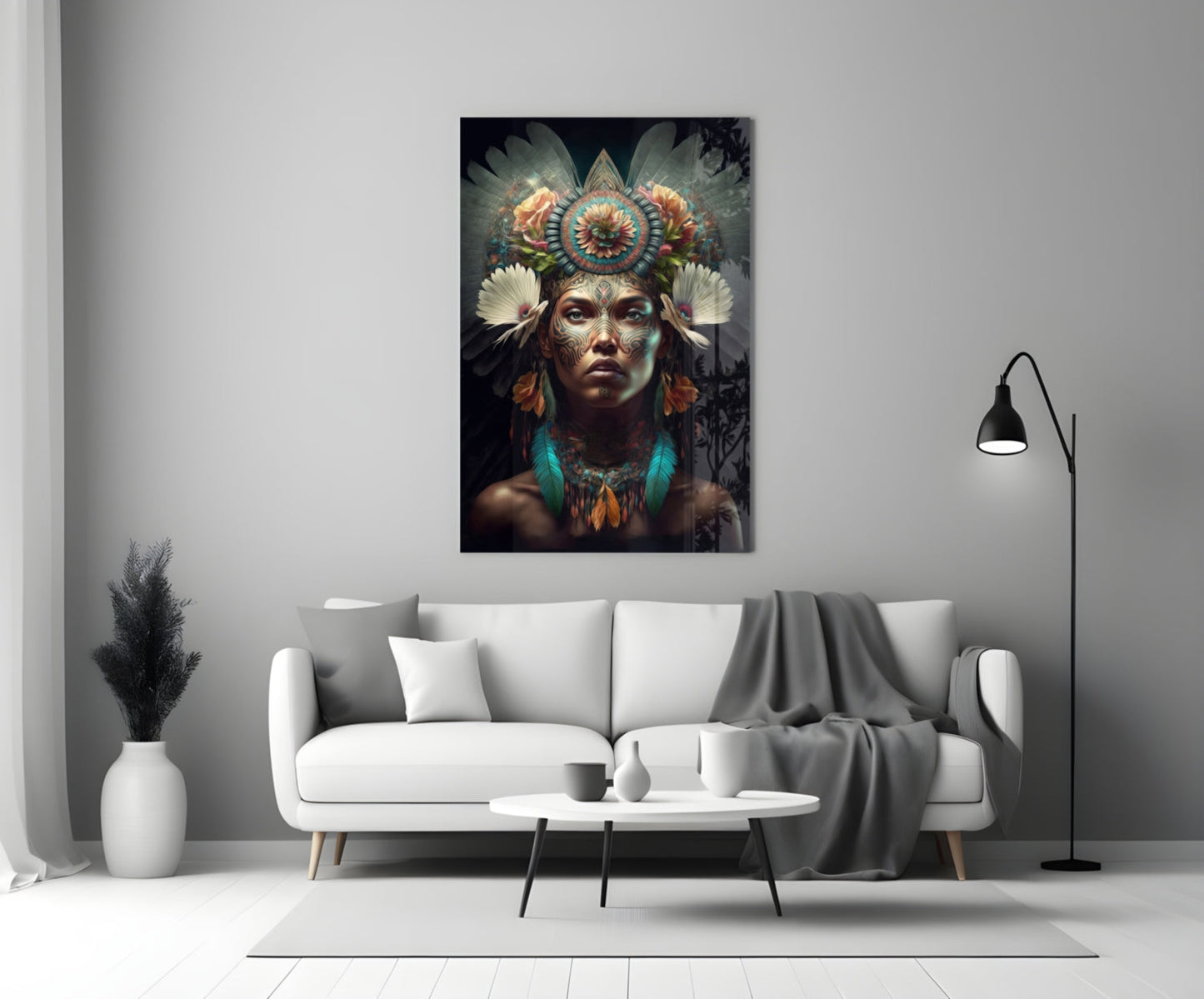 Flower Monarch glass wall art displayed above white sofa in modern living room interior, showing ornate headdress portrait with colorful feather details.