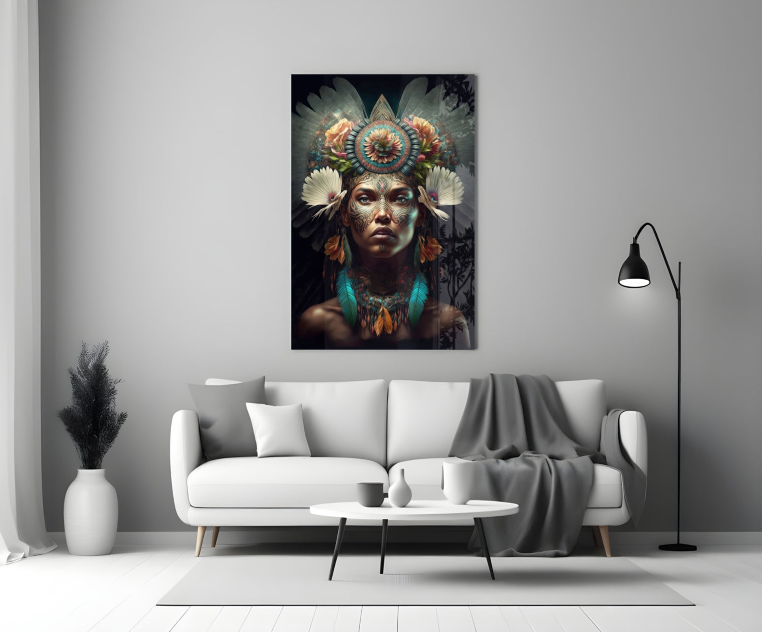 Flower Monarch glass wall art displayed above white sofa in modern living room interior, showing ornate headdress portrait with colorful feather details.
