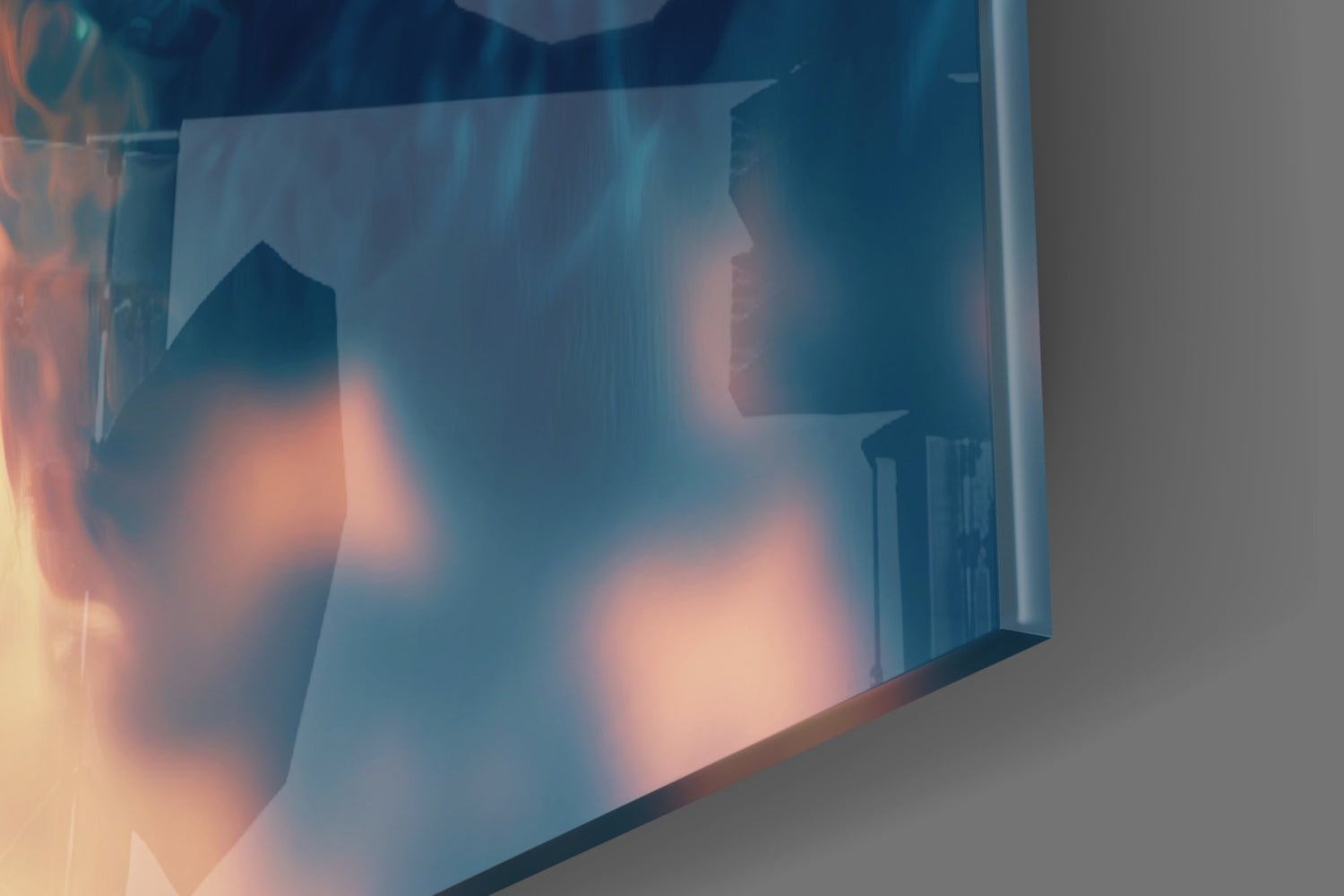 Angled close-up of glass wall art showing blurred cityscape with warm orange and cool blue tones visible through translucent glass surface.