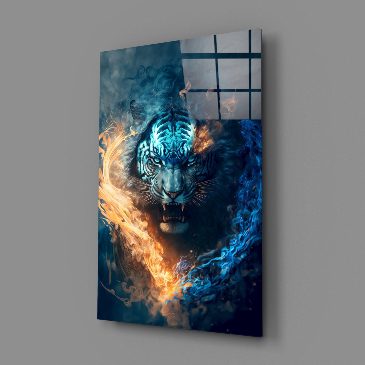 Angled view of glass wall art featuring a tiger with glowing cyan face surrounded by orange and blue flames against a dark background, mounted on a gray wall.