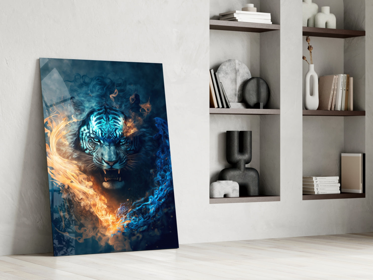 Glass wall art leaning against white wall displays blue tiger with orange and golden flames, displayed beside white shelving unit with decorative objects and books.