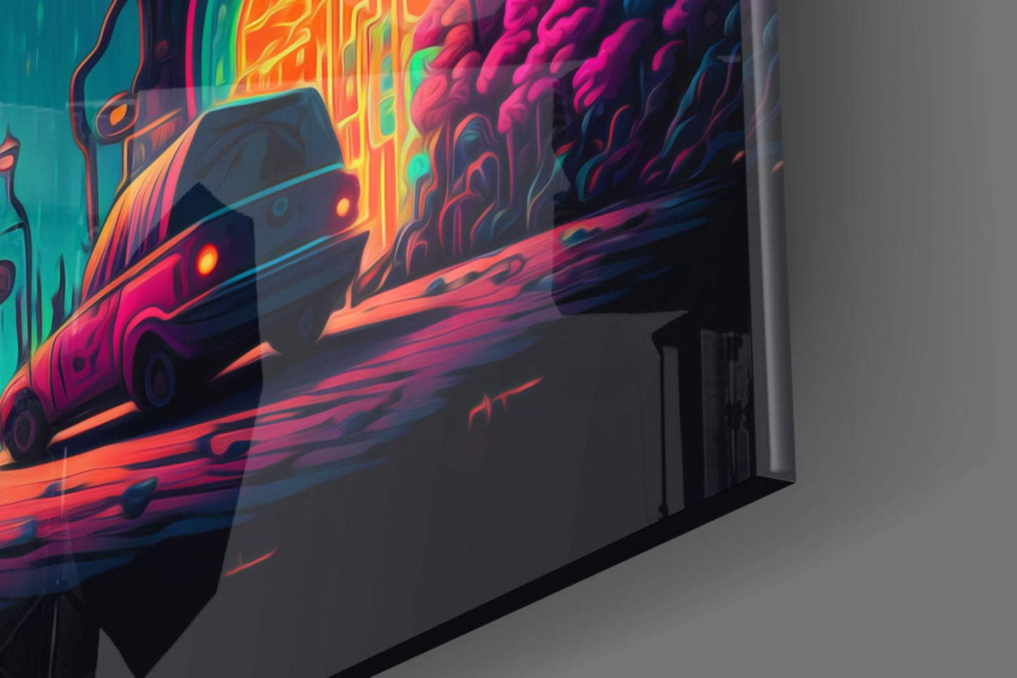 Angled side view of neon-lit glass wall art featuring a futuristic car in vibrant pink, orange, and teal colors against a gray wall.
