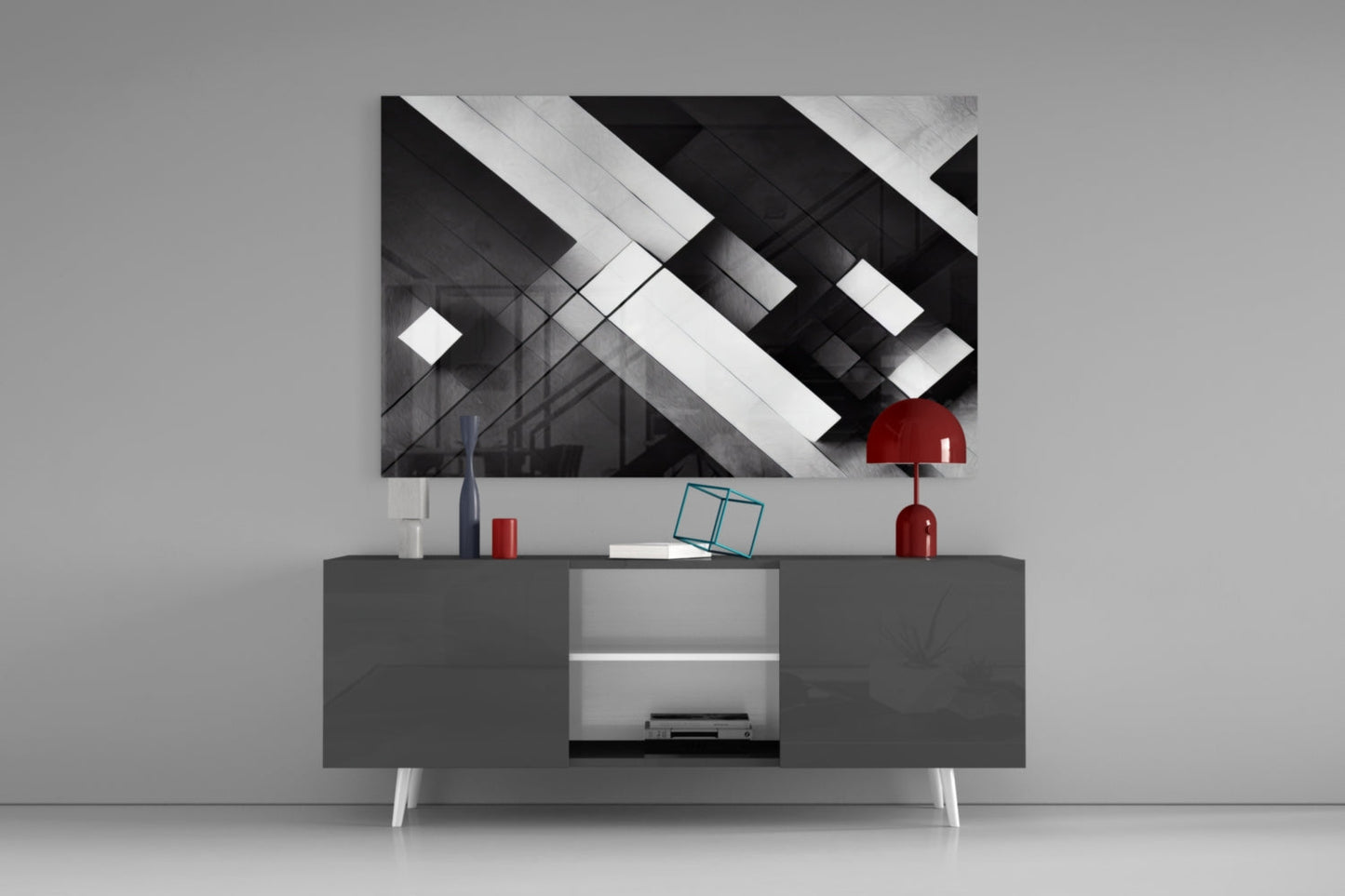 Modern living room display showing black and white geometric cubic glass wall art hung above dark media console with red accents.
