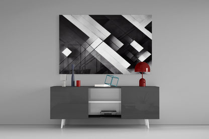 Modern living room display showing black and white geometric cubic glass wall art hung above dark media console with red accents.