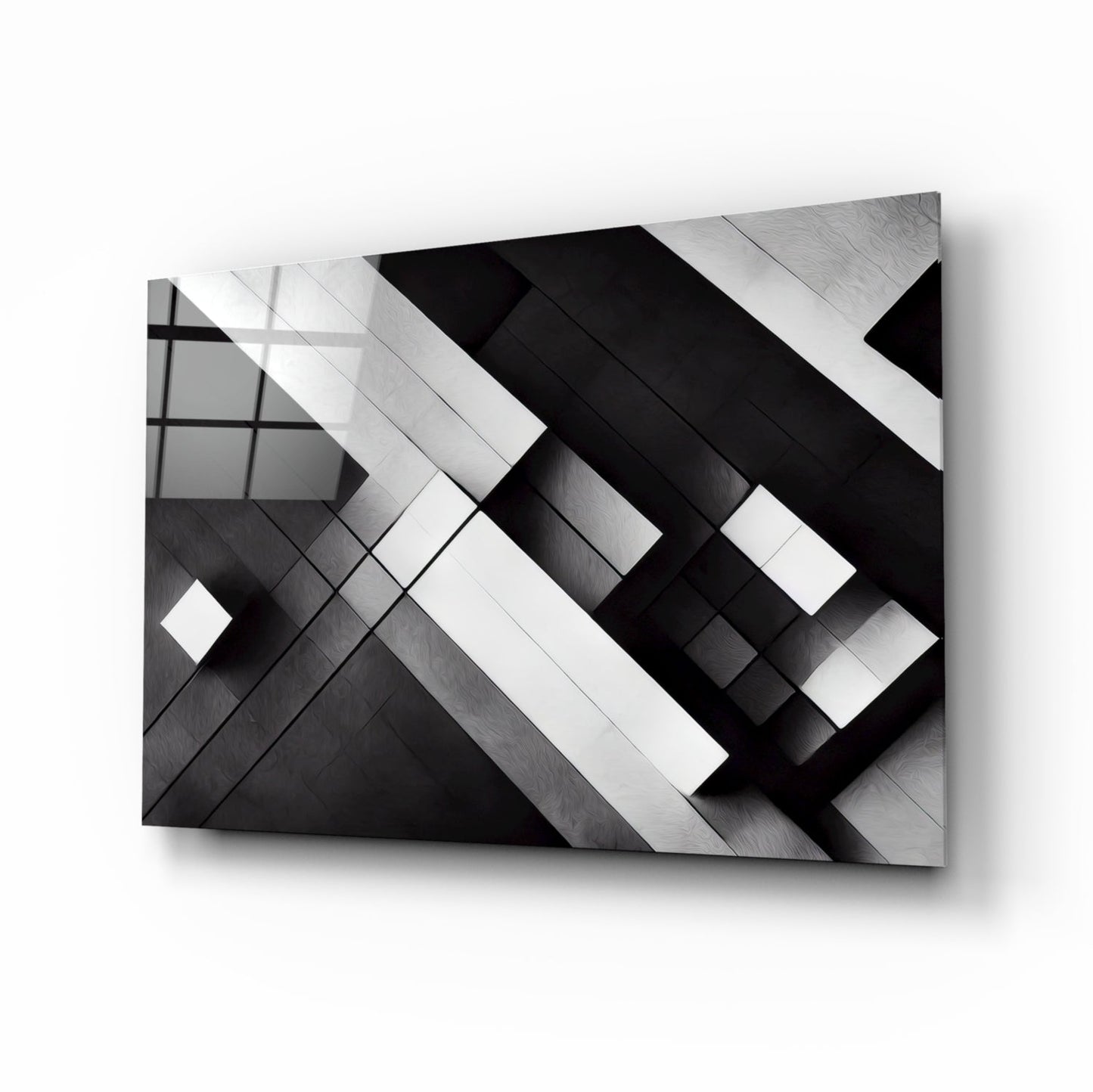 Three-dimensional cubic glass wall art with intersecting black and white geometric planes casting shadows against a light background.