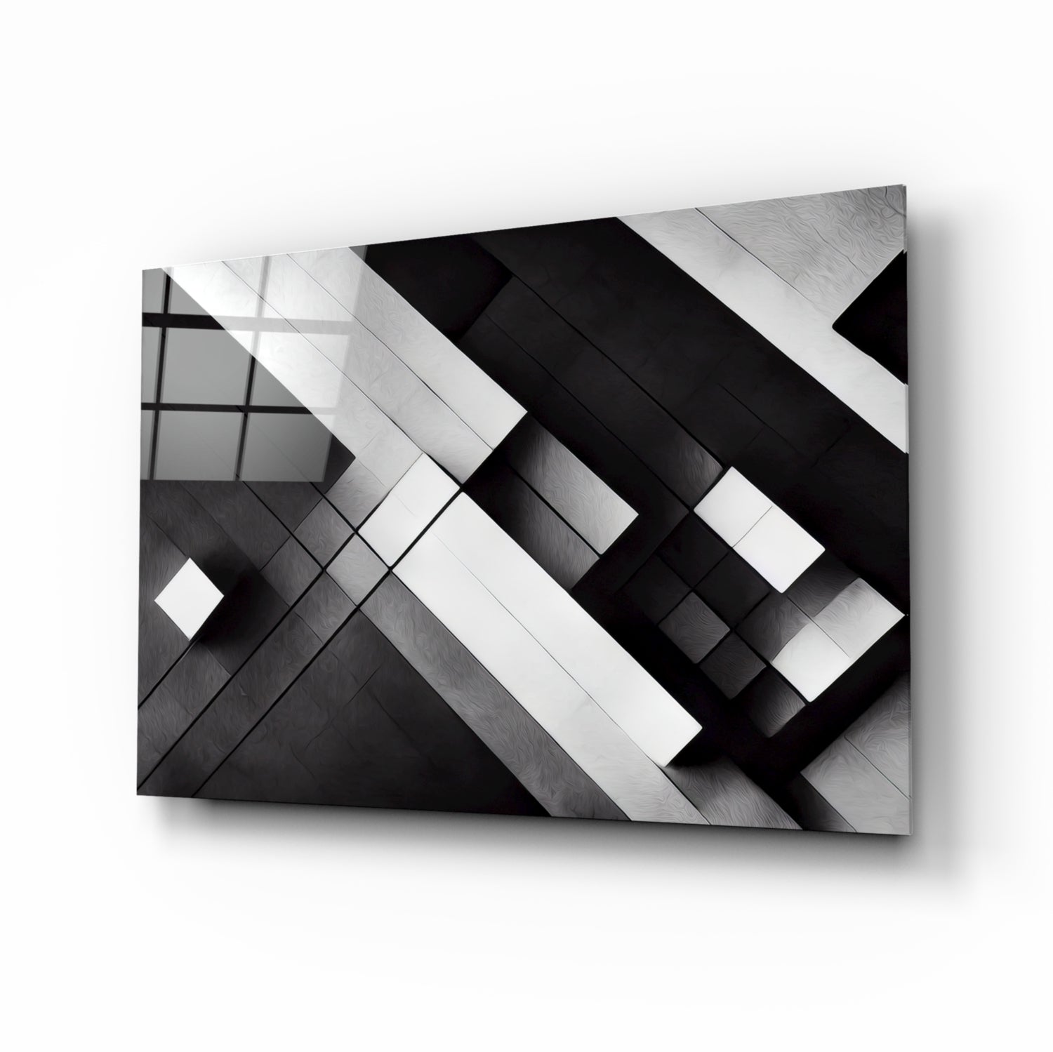 Three-dimensional cubic glass wall art with intersecting black and white geometric planes casting shadows against a light background.
