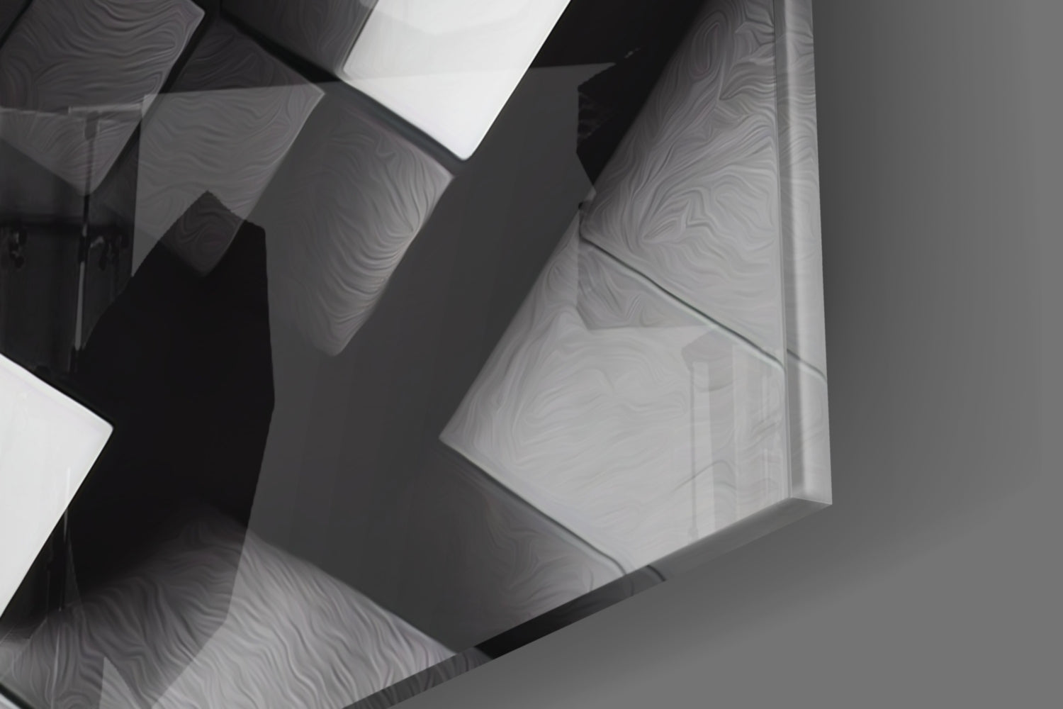 Close-up overhead view of overlapping translucent cubic glass panels with wavy surface textures casting dramatic shadows in monochrome tones.