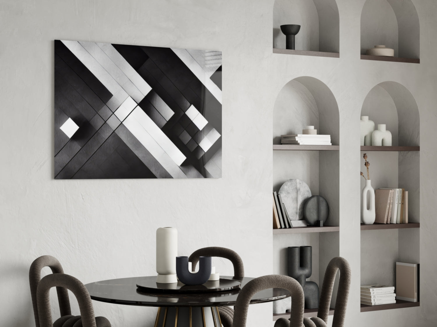 Modern dining room with black and white geometric abstract canvas art displayed above round table with curved chairs.