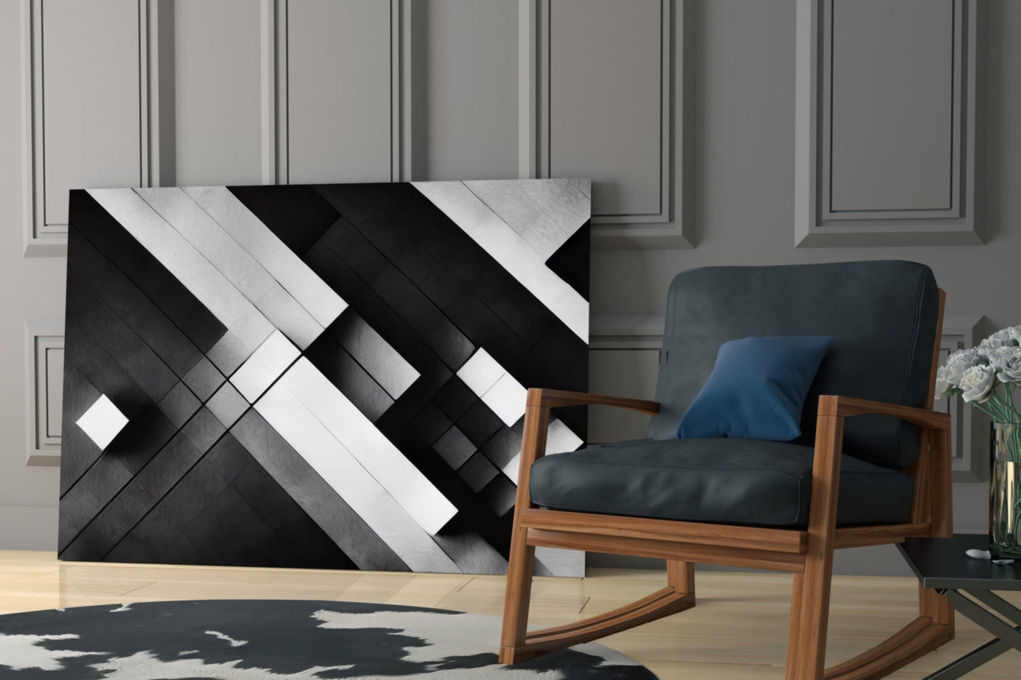 Modern living room featuring black, white, and gray geometric glass wall art above a wooden-framed chair with dark upholstery.