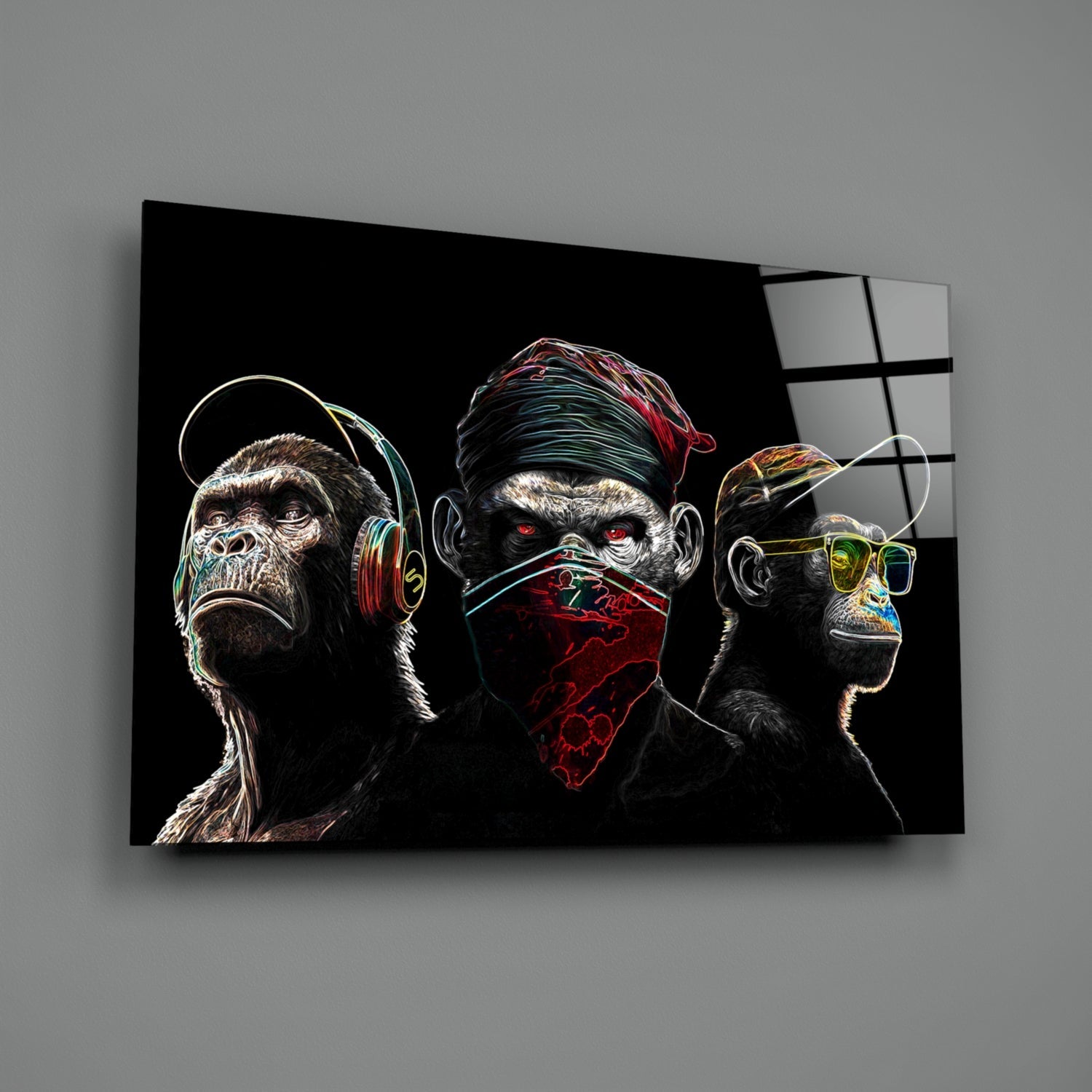Three neon-outlined chimps wearing headphones, bandana, and glasses against black glass, angled perspective view.