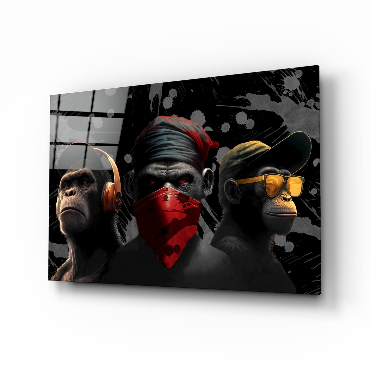 Three stylized black primates wearing red, gold, and yellow accessories against a dark splattered background on a glass panel, displayed at an angled perspective.