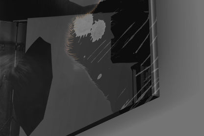 Close-up angled view of frosted glass wall art featuring silhouetted monkey profile in black and white.