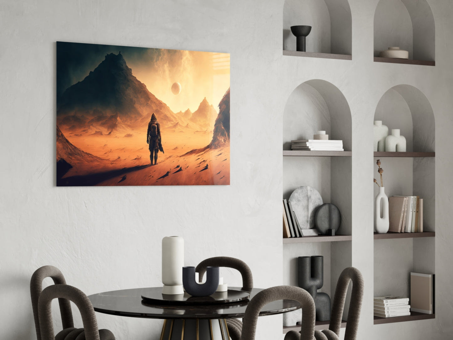 Glass wall art depicting a figure standing in an orange desert landscape with mountains and dual suns, displayed above a dining table.