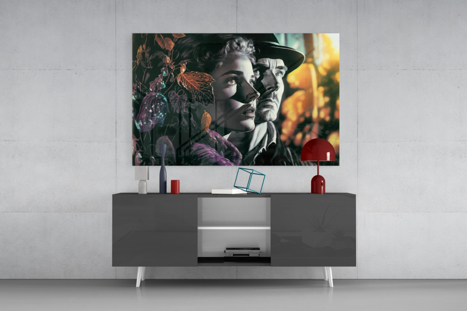 Vintage-style glass wall art depicting two figures among dark foliage displayed above a modern gray media console with red decorative accents.