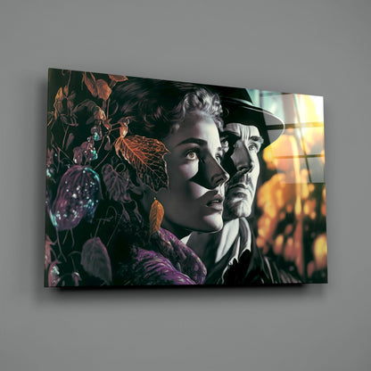 Glass wall art featuring two vintage-style portrait faces among autumn foliage and warm golden light, displayed at an angle against a gray wall.