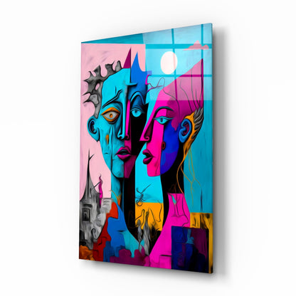 Angled three-quarter view of a glass wall panel featuring vibrant abstract faces in blue, pink, magenta, and black with gold accents against a colorful background.