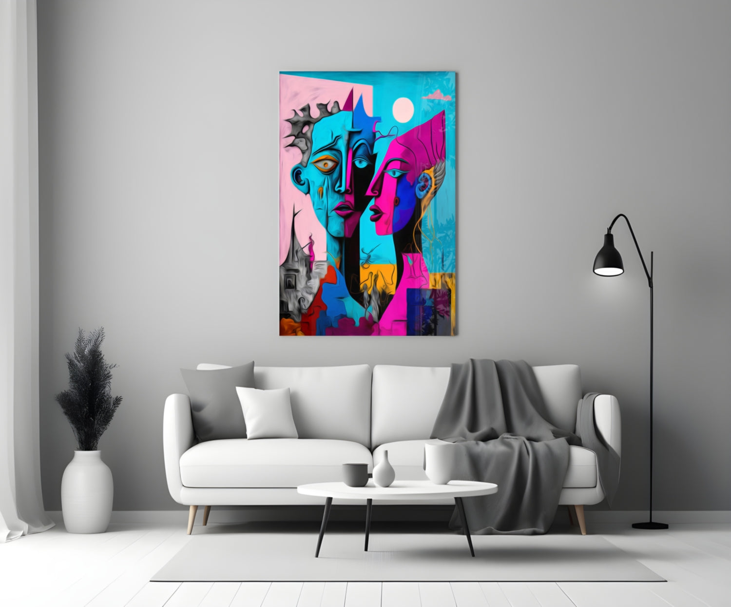 Vibrant abstract portrait glass art hanging above white sofa in modern living room setting.