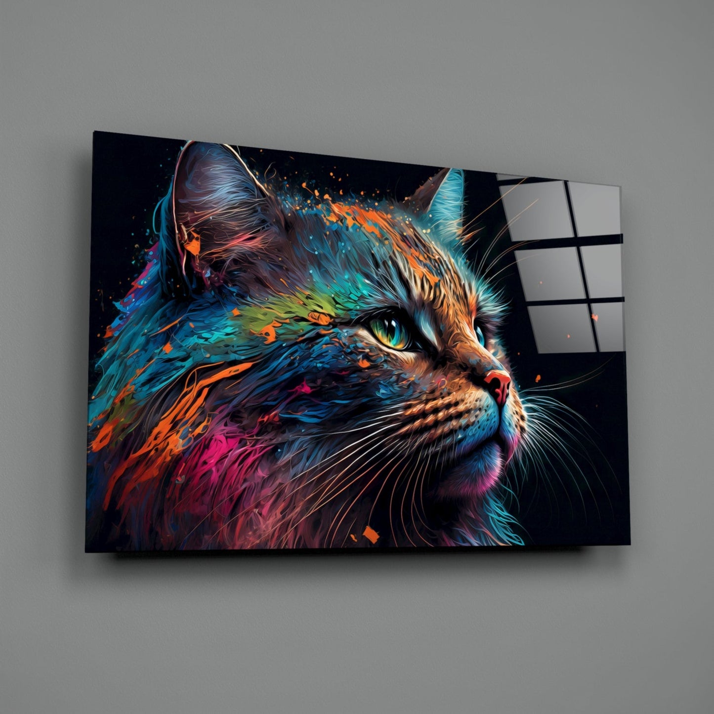 Colorful cat glass wall art mounted on gray wall, displaying vibrant blue, orange, and pink painted cat portrait with green eyes and black background.